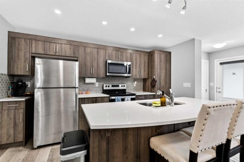 30 Yorkville Boulevard Sw, Calgary, AB - Indoor Photo Showing Kitchen With Stainless Steel Kitchen With Double Sink With Upgraded Kitchen
