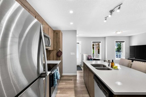 30 Yorkville Boulevard Sw, Calgary, AB - Indoor Photo Showing Kitchen With Stainless Steel Kitchen With Double Sink With Upgraded Kitchen