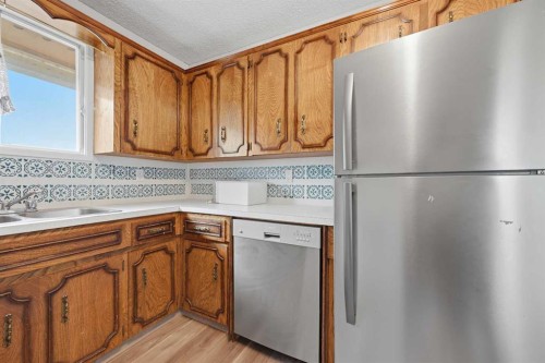 228 Berwick Drive Nw, Calgary, AB - Indoor Photo Showing Kitchen With Double Sink