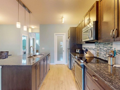 122 Midtown Boulevard Sw, Airdrie, AB - Indoor Photo Showing Kitchen With Upgraded Kitchen