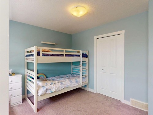 122 Midtown Boulevard Sw, Airdrie, AB - Indoor Photo Showing Bedroom
