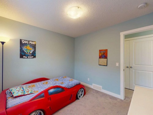122 Midtown Boulevard Sw, Airdrie, AB - Indoor Photo Showing Bedroom