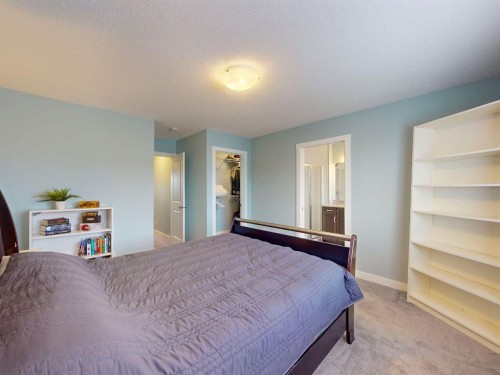 122 Midtown Boulevard Sw, Airdrie, AB - Indoor Photo Showing Bedroom