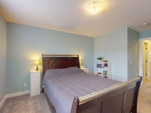 122 Midtown Boulevard Sw, Airdrie, AB - Indoor Photo Showing Bedroom