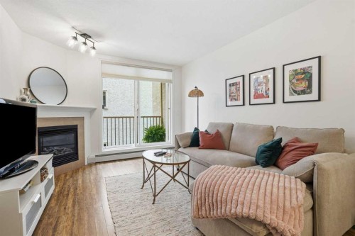 202-1833 11 Avenue Sw, Calgary, AB - Indoor Photo Showing Living Room With Fireplace