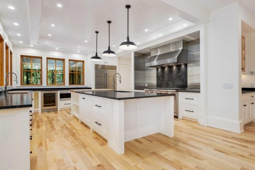 212 Hawk'S Landing Rise, Priddis Greens, AB - Indoor Photo Showing Kitchen With Upgraded Kitchen
