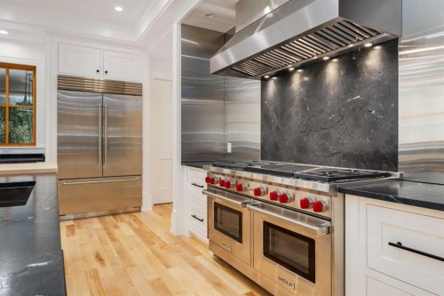 212 Hawk'S Landing Rise, Priddis Greens, AB - Indoor Photo Showing Kitchen With Upgraded Kitchen