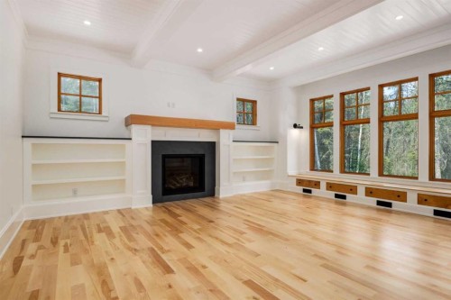 212 Hawk'S Landing Rise, Priddis Greens, AB - Indoor Photo Showing Other Room With Fireplace