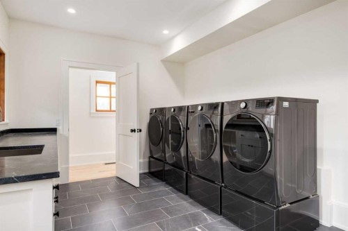 212 Hawk'S Landing Rise, Priddis Greens, AB - Indoor Photo Showing Laundry Room