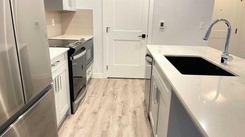 115-40 Sage Hill Nw, Calgary, AB - Indoor Photo Showing Kitchen With Stainless Steel Kitchen With Upgraded Kitchen