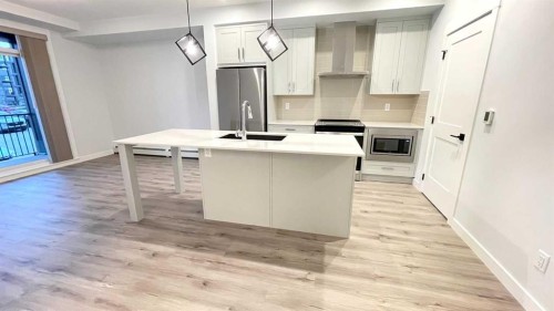 115-40 Sage Hill Nw, Calgary, AB - Indoor Photo Showing Kitchen With Stainless Steel Kitchen With Upgraded Kitchen