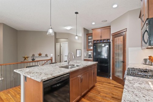 204 Sunset Square, Cochrane, AB - Indoor Photo Showing Kitchen With Double Sink With Upgraded Kitchen