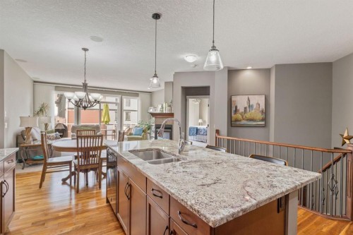 204 Sunset Square, Cochrane, AB - Indoor Photo Showing Kitchen With Double Sink With Upgraded Kitchen