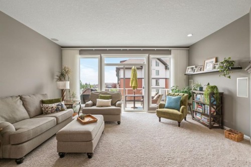 204 Sunset Square, Cochrane, AB - Indoor Photo Showing Living Room