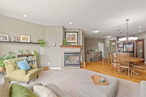 204 Sunset Square, Cochrane, AB - Indoor Photo Showing Living Room With Fireplace