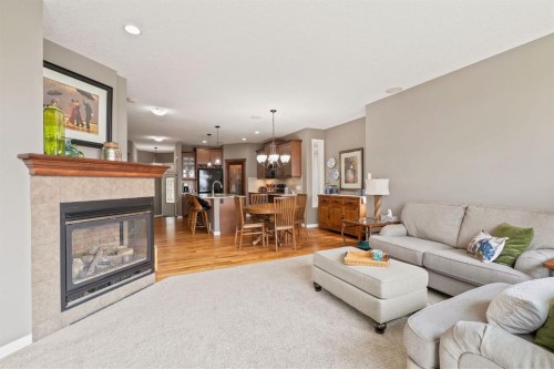 204 Sunset Square, Cochrane, AB - Indoor Photo Showing Living Room With Fireplace