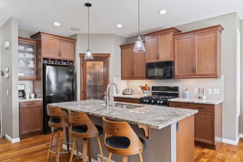 204 Sunset Square, Cochrane, AB - Indoor Photo Showing Kitchen With Double Sink