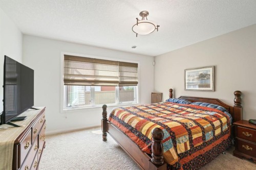 204 Sunset Square, Cochrane, AB - Indoor Photo Showing Bedroom