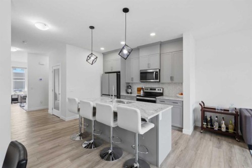 144 Amblehurst Green Nw, Calgary, AB - Indoor Photo Showing Kitchen With Stainless Steel Kitchen With Upgraded Kitchen