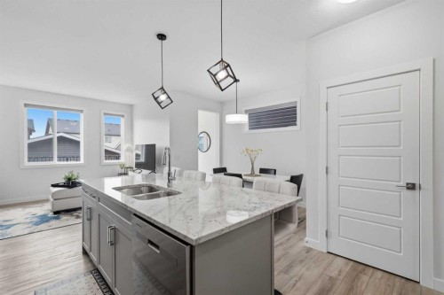 144 Amblehurst Green Nw, Calgary, AB - Indoor Photo Showing Kitchen With Double Sink