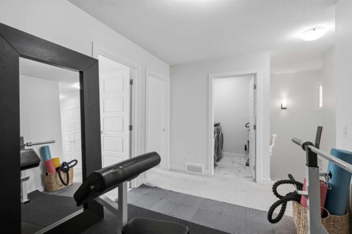 144 Amblehurst Green Nw, Calgary, AB - Indoor Photo Showing Gym Room