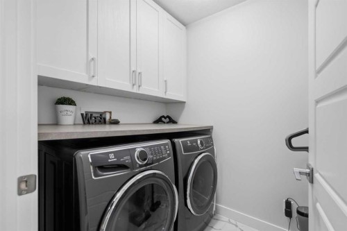 144 Amblehurst Green Nw, Calgary, AB - Indoor Photo Showing Laundry Room