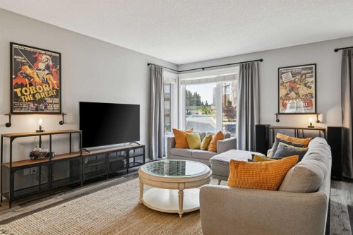 102 Shawnee Common Sw, Calgary, AB - Indoor Photo Showing Living Room