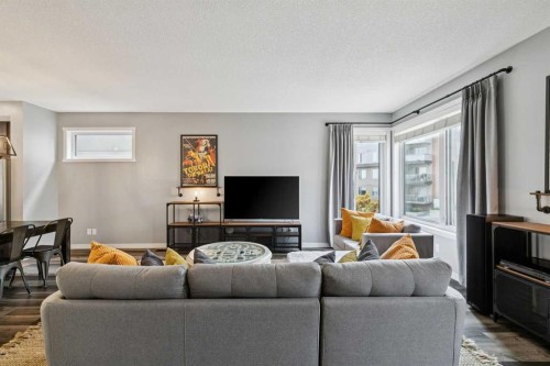 102 Shawnee Common Sw, Calgary, AB - Indoor Photo Showing Living Room
