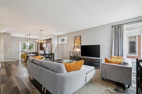 102 Shawnee Common Sw, Calgary, AB - Indoor Photo Showing Living Room