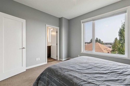 102 Shawnee Common Sw, Calgary, AB - Indoor Photo Showing Bedroom