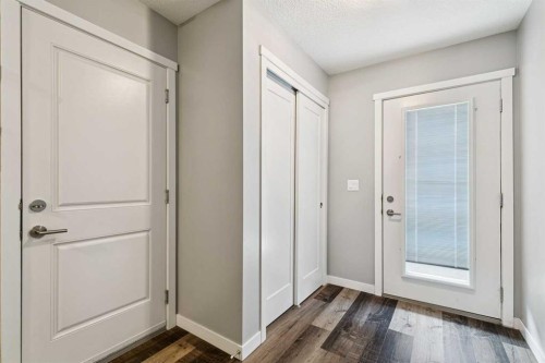 102 Shawnee Common Sw, Calgary, AB - Indoor Photo Showing Other Room