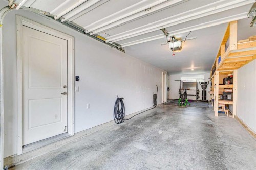 102 Shawnee Common Sw, Calgary, AB - Indoor Photo Showing Garage