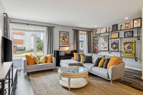 102 Shawnee Common Sw, Calgary, AB - Indoor Photo Showing Living Room