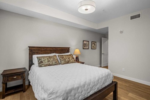 307-1505 Spring Creek Gate, Canmore, AB - Indoor Photo Showing Bedroom