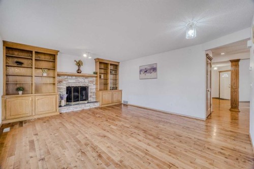 10057 Hamptons Boulevard Nw, Calgary, AB - Indoor Photo Showing Living Room With Fireplace