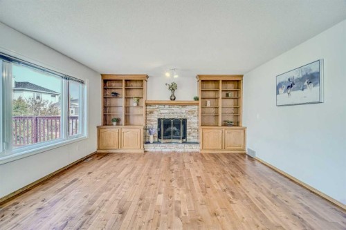 10057 Hamptons Boulevard Nw, Calgary, AB - Indoor Photo Showing Living Room With Fireplace