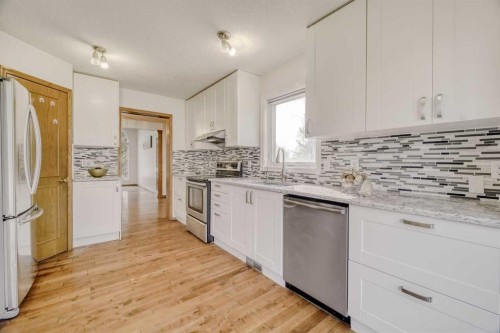 10057 Hamptons Boulevard Nw, Calgary, AB - Indoor Photo Showing Kitchen With Stainless Steel Kitchen With Upgraded Kitchen
