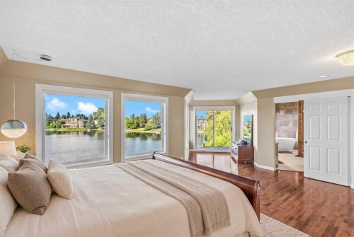 85 Sunset Way Se, Calgary, AB - Indoor Photo Showing Bedroom