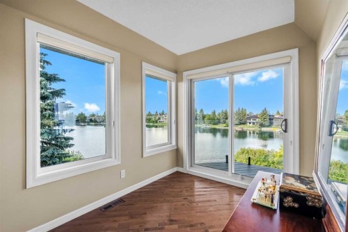 85 Sunset Way Se, Calgary, AB - Indoor Photo Showing Other Room With Body Of Water
