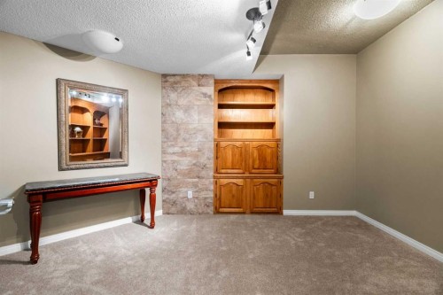 85 Sunset Way Se, Calgary, AB - Indoor Photo Showing Other Room