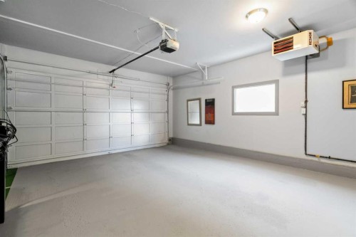 85 Sunset Way Se, Calgary, AB - Indoor Photo Showing Garage