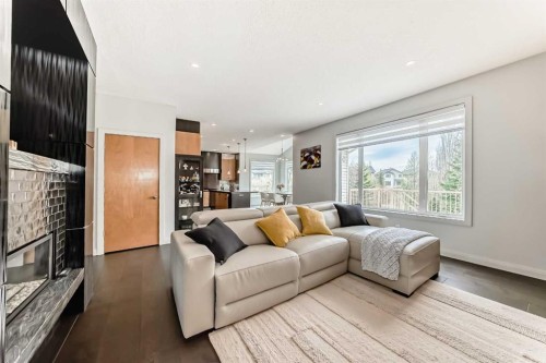 11 Cresthaven Bay Sw, Calgary, AB - Indoor Photo Showing Living Room With Fireplace