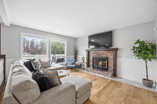 311 Hawkland Place Nw, Calgary, AB - Indoor Photo Showing Living Room With Fireplace