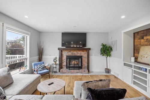 311 Hawkland Place Nw, Calgary, AB - Indoor Photo Showing Living Room With Fireplace