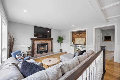 311 Hawkland Place Nw, Calgary, AB - Indoor Photo Showing Living Room With Fireplace