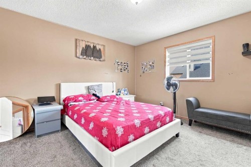610 Saddlecreek Way Ne, Calgary, AB - Indoor Photo Showing Bedroom