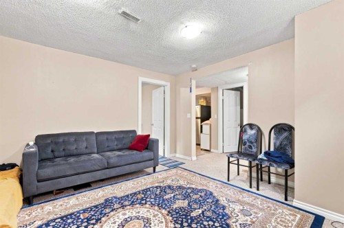 610 Saddlecreek Way Ne, Calgary, AB - Indoor Photo Showing Living Room