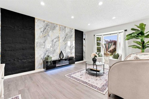 427 Falmere Road Ne, Calgary, AB - Indoor Photo Showing Other Room With Fireplace
