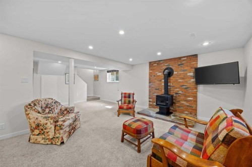 30 Gateway Drive Sw, Calgary, AB - Indoor With Fireplace