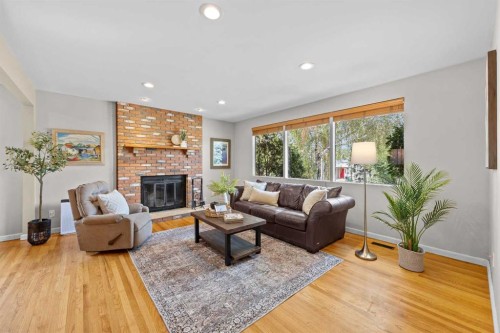30 Gateway Drive Sw, Calgary, AB - Indoor Photo Showing Living Room With Fireplace